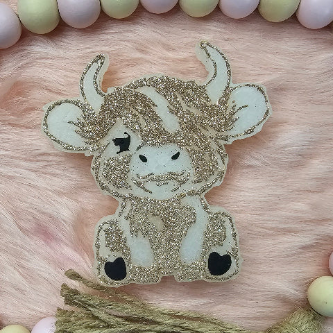 Sitting Highland Cow